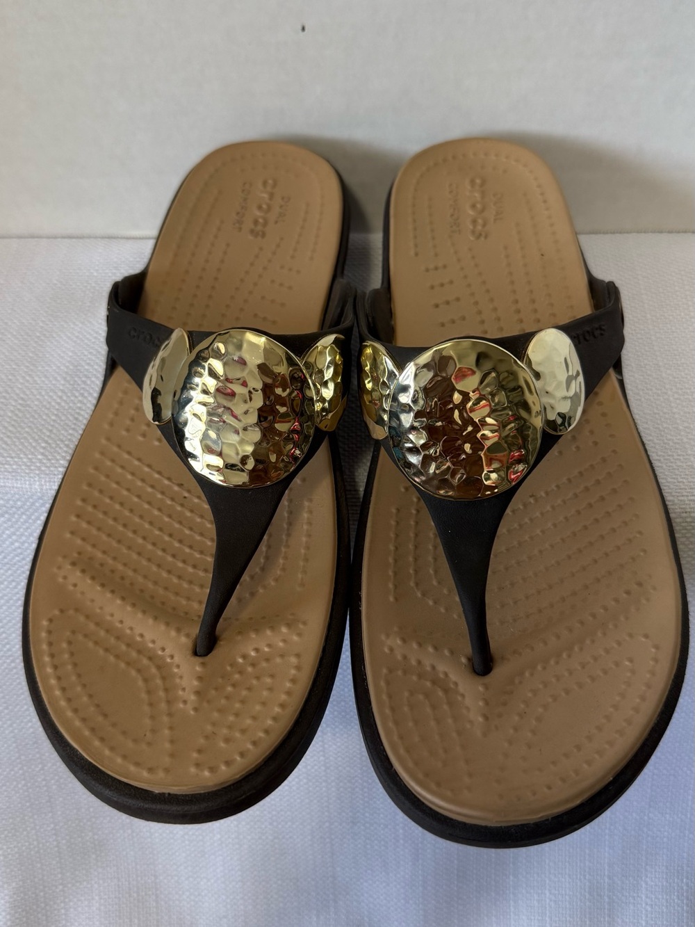 CROCS Women’s Brown Thong Sandals with Gold Medallion Accents
